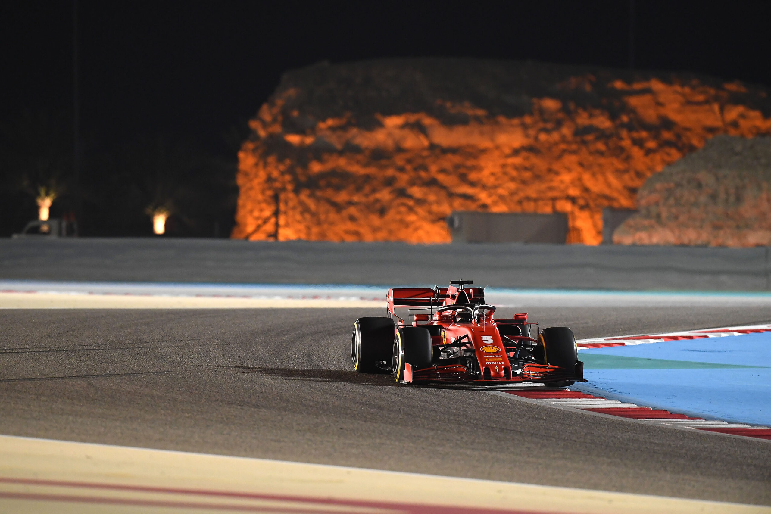 Sebastian Vettel drives under lights